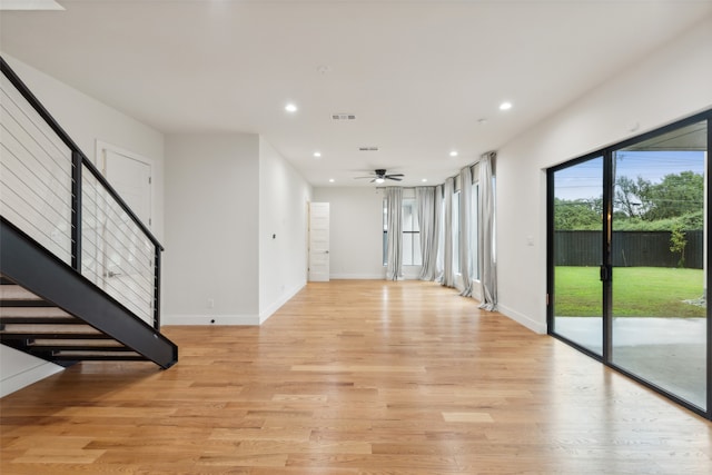 interior space with light hardwood / wood-style floors and ceiling fan