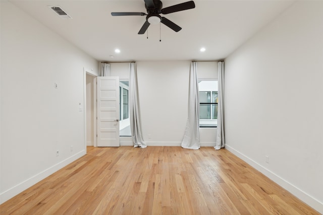 spare room featuring light hardwood / wood-style flooring and ceiling fan