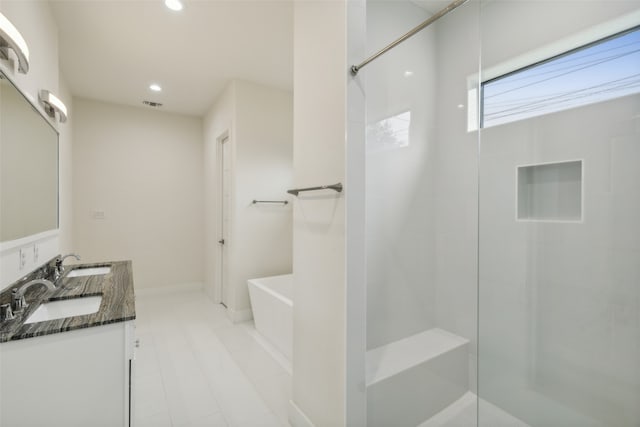 bathroom featuring independent shower and bath and vanity