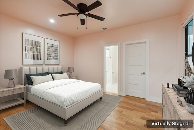 bedroom featuring light wood-type flooring and ceiling fan