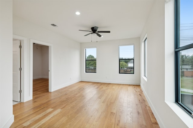 empty room featuring ceiling fan and light hardwood / wood-style flooring