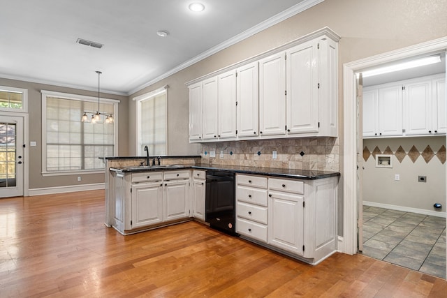 kitchen with white cabinetry, kitchen peninsula, light hardwood / wood-style flooring, and black dishwasher