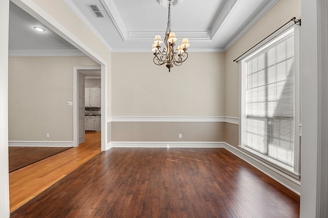 unfurnished room featuring plenty of natural light, a chandelier, crown molding, and dark hardwood / wood-style flooring