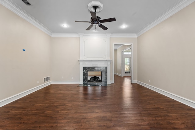 unfurnished living room featuring a fireplace, ceiling fan, dark hardwood / wood-style flooring, and ornamental molding