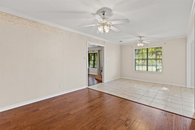 spare room with crown molding, ceiling fan, and light hardwood / wood-style flooring