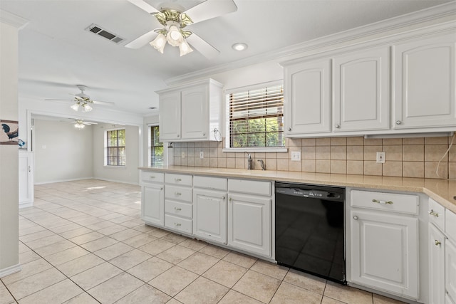 kitchen featuring light tile patterned flooring, tasteful backsplash, a healthy amount of sunlight, white cabinets, and black dishwasher