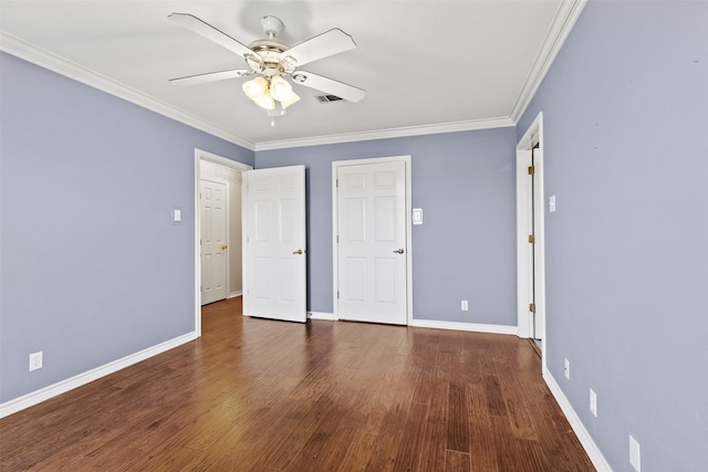 unfurnished bedroom with dark hardwood / wood-style flooring, ornamental molding, and ceiling fan