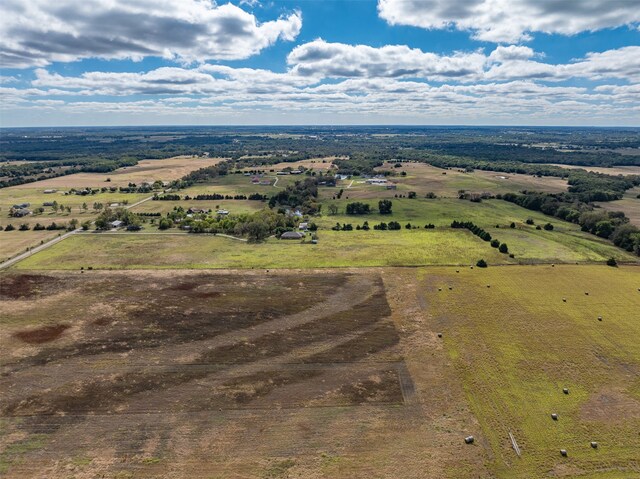 birds eye view of property featuring a rural view