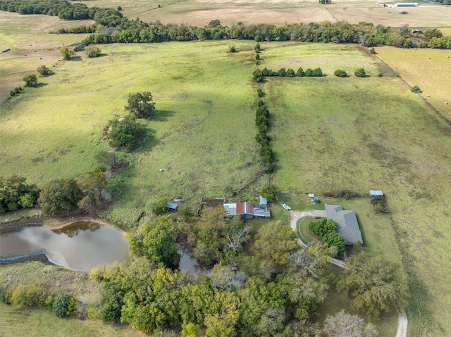 drone / aerial view featuring a water view and a rural view