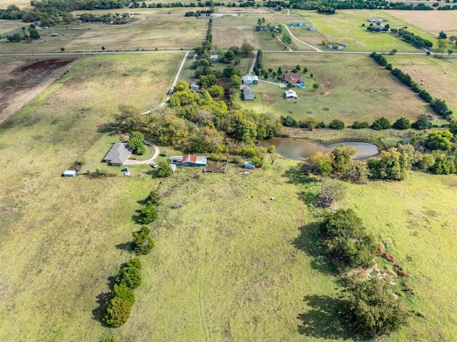 aerial view with a rural view and a water view