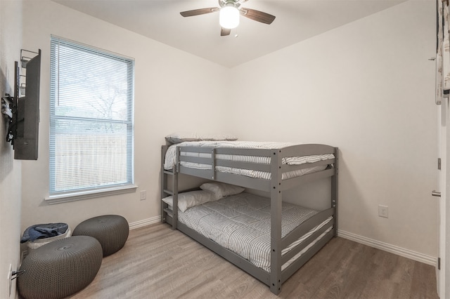 bedroom with ceiling fan and wood-type flooring