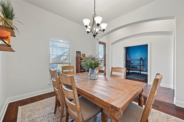 exercise room with french doors, ceiling fan, vaulted ceiling, and hardwood / wood-style flooring