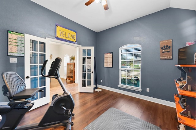 exercise room featuring french doors, ceiling fan, lofted ceiling, and wood-type flooring