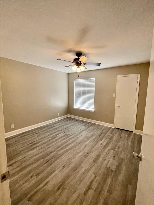 4748 Old Bent Tree Ln Unit 1104, Dallas, TX 75287 - empty room with a ceiling fan, wood finished floors, and baseboards