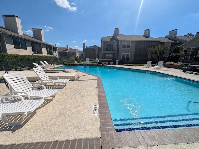 view of swimming pool with a patio