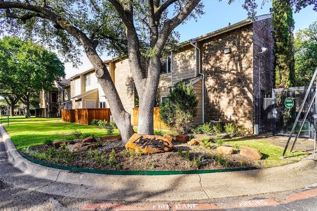 view of side of property with a lawn