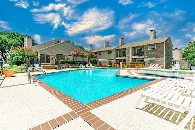 view of pool featuring a patio area