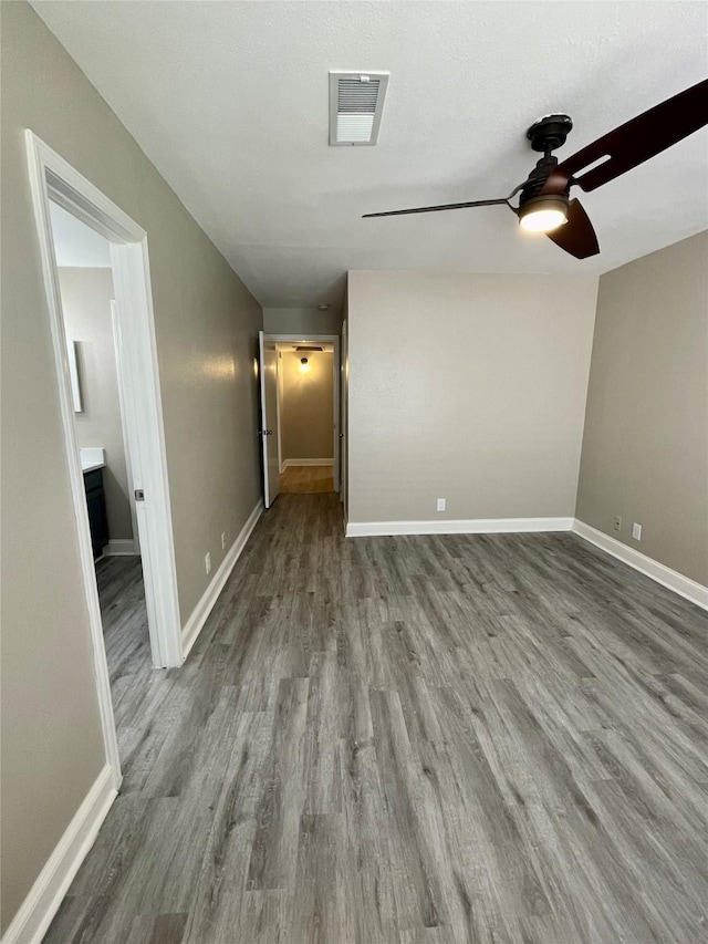 4748 Old Bent Tree Ln Unit 1104, Dallas, TX 75287 - empty room with a ceiling fan, wood finished floors, and baseboards
