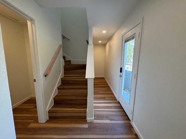 stairs with hardwood / wood-style flooring