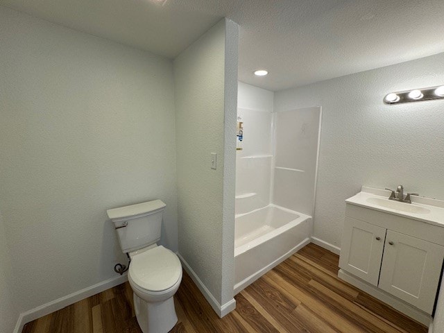 full bathroom featuring toilet, shower / bathing tub combination, vanity, and hardwood / wood-style flooring