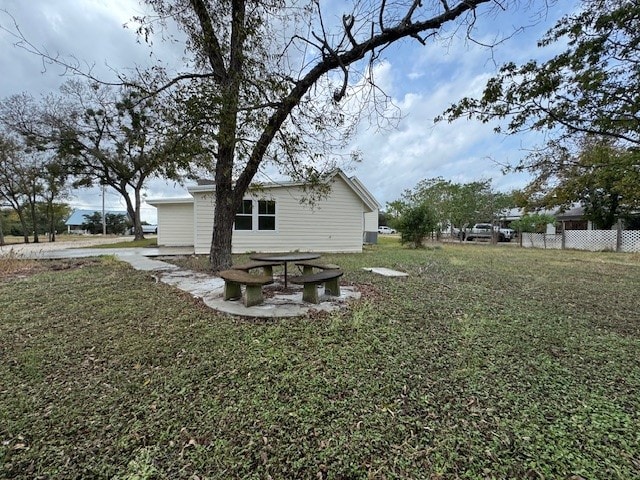 rear view of property with a yard