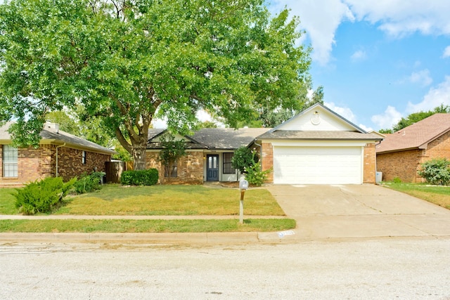 ranch-style home featuring a front yard and a garage