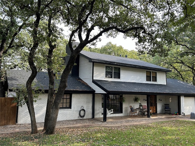 view of front facade with a garage and a porch