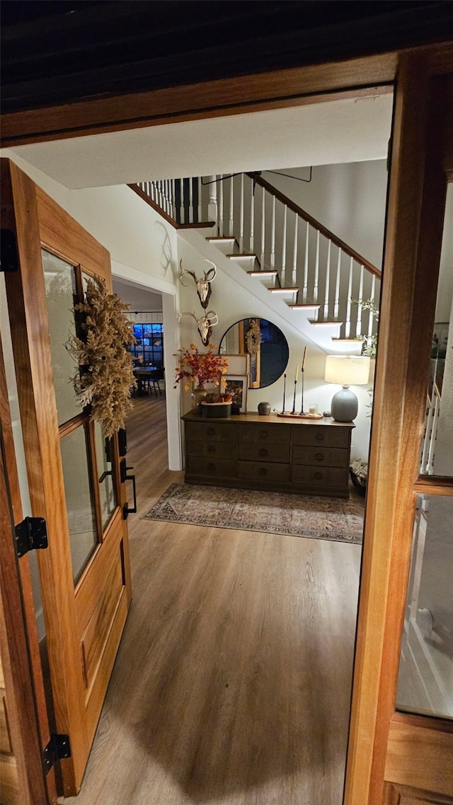 staircase featuring wood-type flooring