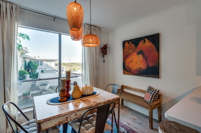 dining area with hardwood / wood-style floors