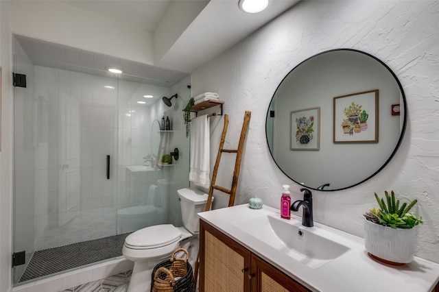 bathroom featuring toilet, an enclosed shower, and vanity