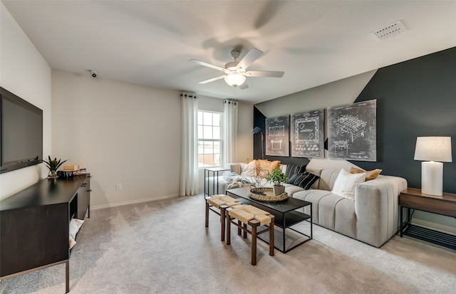 living room featuring light carpet and ceiling fan