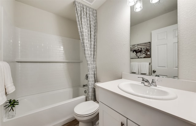 full bathroom with shower / bath combo, vanity, and toilet