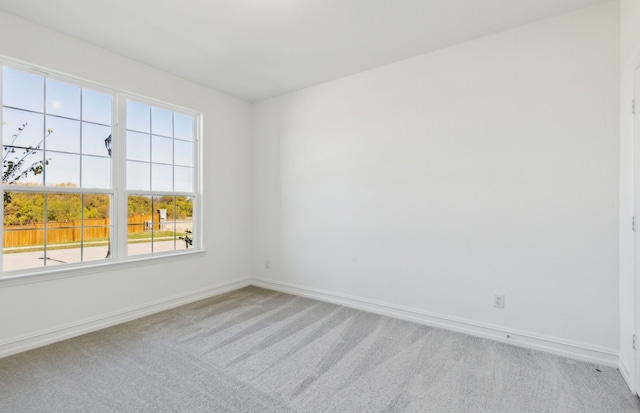 empty room featuring light colored carpet