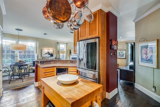 kitchen with wine cooler, kitchen peninsula, dark hardwood / wood-style floors, crown molding, and stainless steel fridge