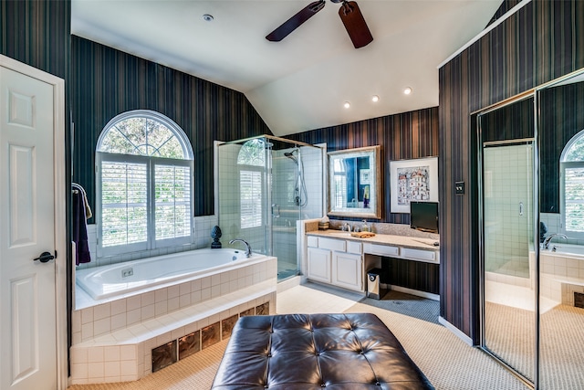 bathroom with tile patterned floors, vanity, independent shower and bath, lofted ceiling, and ceiling fan