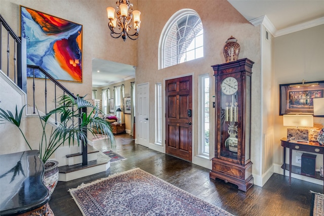 7009 Sharps Dr, Plano, TX 75025 - entrance foyer featuring wood-type flooring, stairs, baseboards, a chandelier, and crown molding