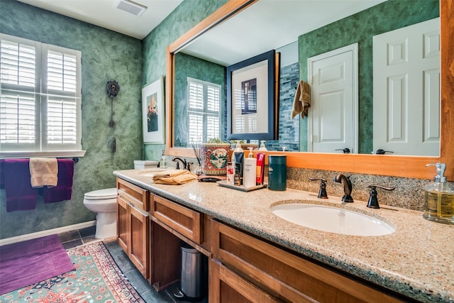 7009 Sharps Dr, Plano, TX 75025 - full bathroom with plenty of natural light, tile patterned floors, toilet, and baseboards