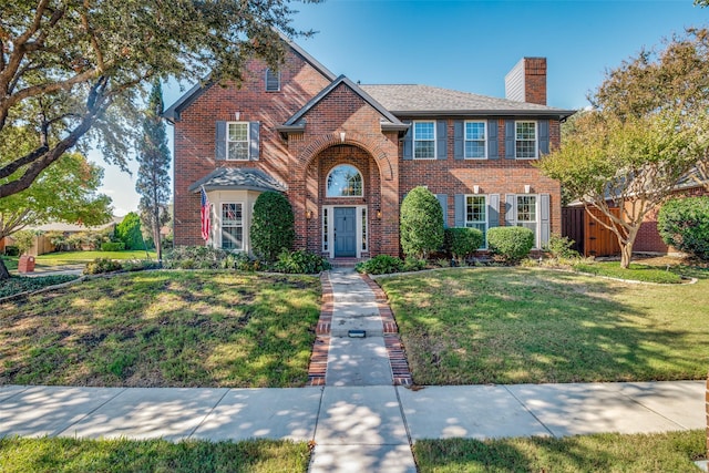 7009 Sharps Dr, Plano, TX 75025 - view of front of property with brick siding and a chimney