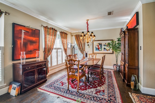 dining room featuring ornamental molding, dark wood-type flooring, and a notable chandelier