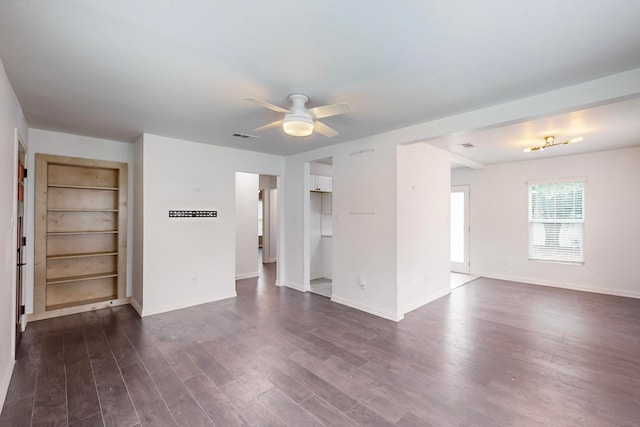 empty room with dark wood-type flooring and ceiling fan