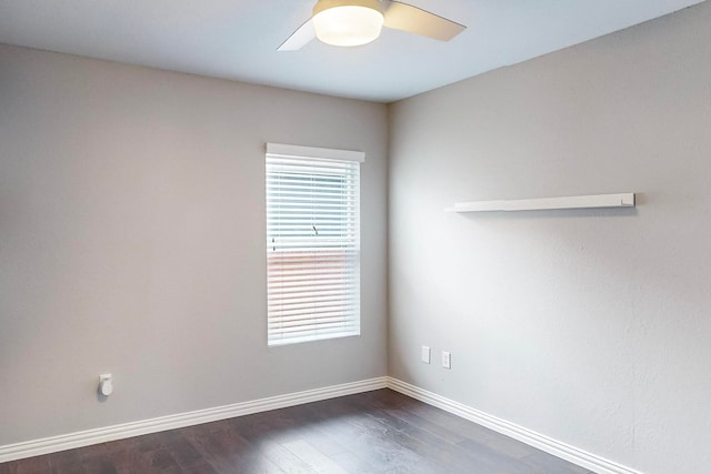 empty room with dark wood-type flooring and ceiling fan