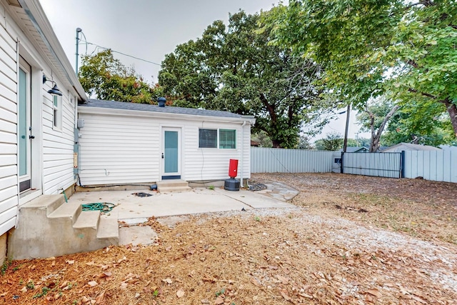 rear view of property featuring a patio