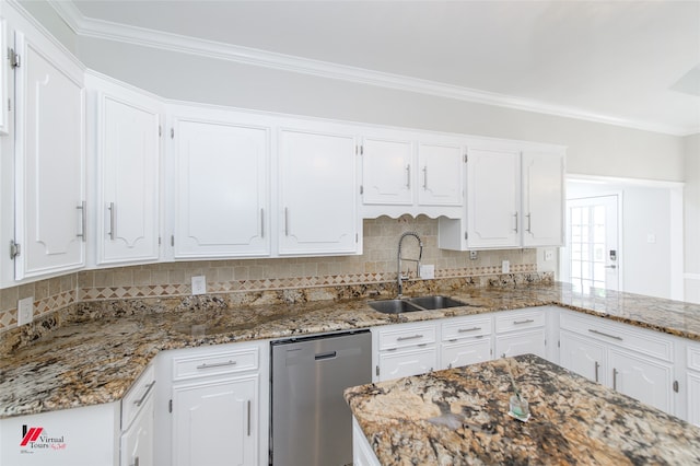 kitchen featuring dark stone counters, white cabinetry, backsplash, sink, and stainless steel dishwasher