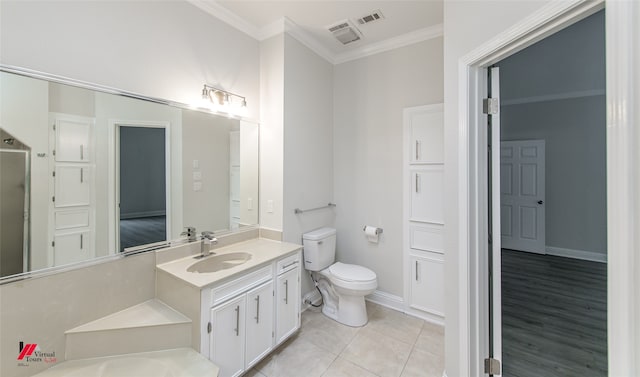 bathroom with hardwood / wood-style flooring, vanity, toilet, and crown molding