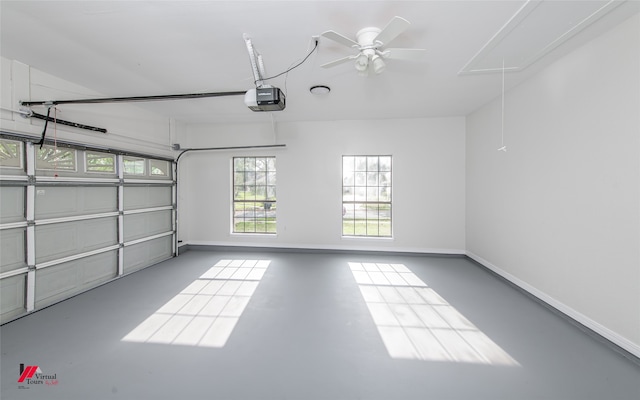 garage with a garage door opener and ceiling fan