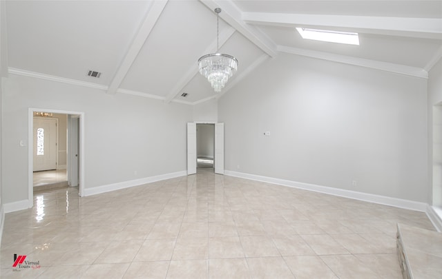 tiled empty room with beamed ceiling, high vaulted ceiling, an inviting chandelier, and a skylight