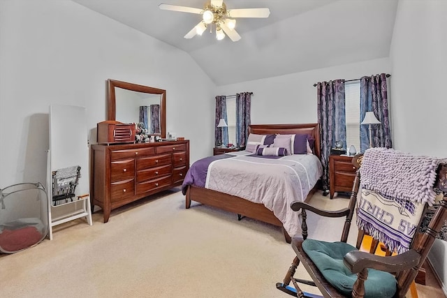 carpeted bedroom with lofted ceiling and ceiling fan