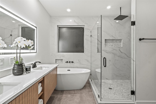 bathroom with vanity, tile patterned floors, and independent shower and bath