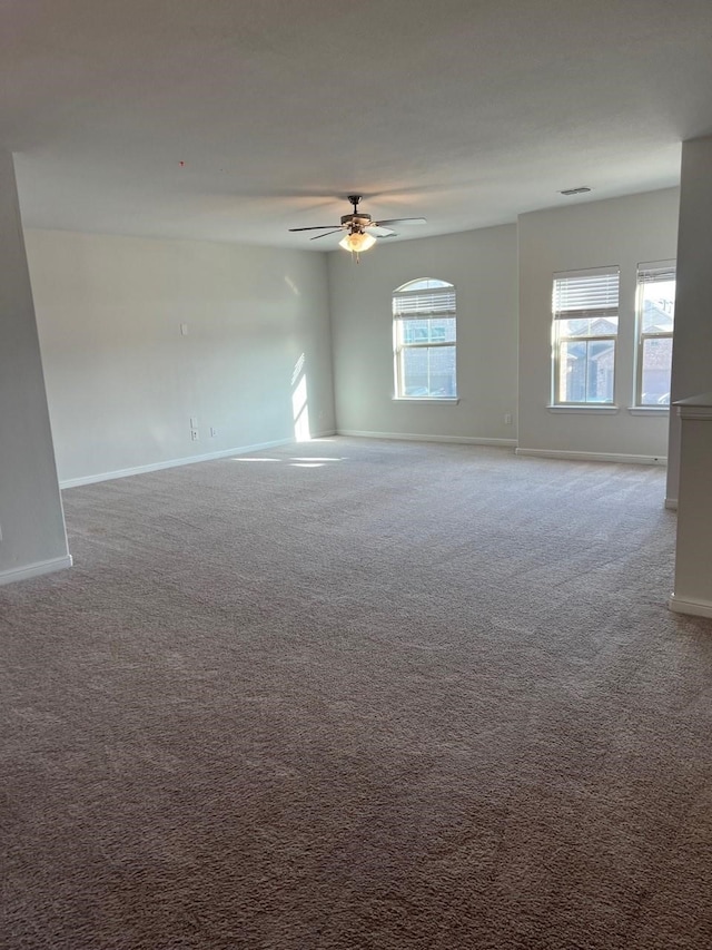 empty room with carpet and ceiling fan