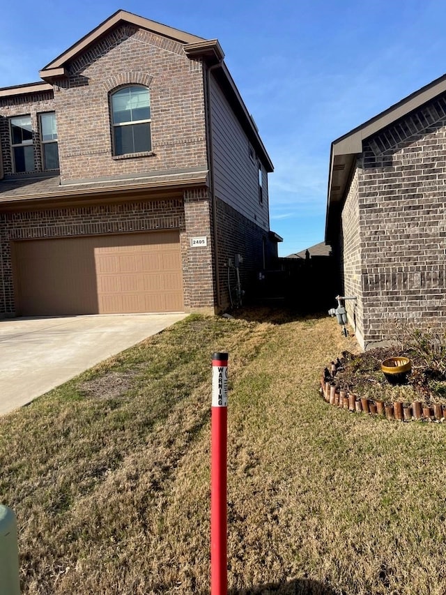 view of home's exterior with a garage and a yard